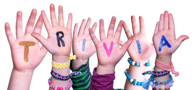 children raising hands for trivia