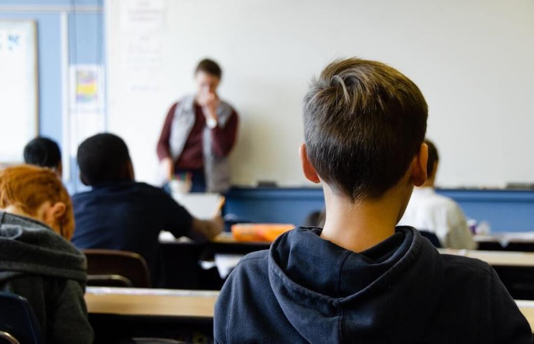 student and teacher in class