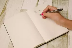 Unknown person writing plans min Unknown person writing plans
